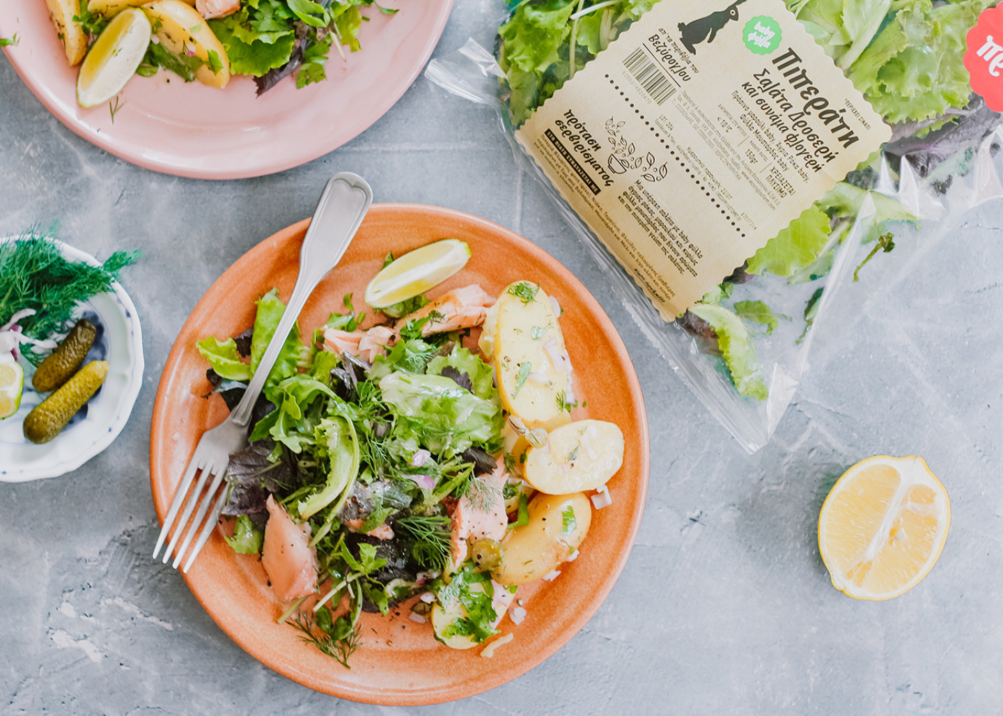 Piperati Salad with grilled salmon, small potatoes and pickled cucumber